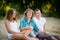 Happy family spending time together outside in green nature