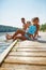 Happy family splashing water at a lake