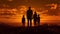 Happy family stands together against the dramatic colors of the sunset