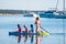 Happy Family on SUP stand up paddle on vacation