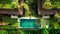 Happy family swims and relaxes in a luxurious infinity pool in a tropical paradise in Ubud, Bali, Indonesia. Anhera