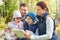 Happy family with tablet pc at camp