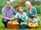 Happy family with teenager holding baskets