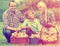 Happy family with teenager holding baskets