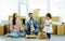 Happy family with three members Caucasian father, Asian mother and little daughter laughing, playing ukulele, dancing and singing