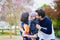 Happy family of three in Paris on a spring day