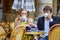 Happy family of three in Parisian cafe