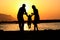 Happy family of three playing silhouette