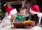 Happy family of three reading book together on Christmas evening