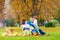 Happy family together on autumn picnic