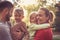 Happy family with two children poses to camera.