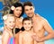 Happy family with two children at tropical beach