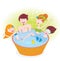 Happy family with two children in whirlpool bath