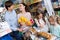 Happy family with two daughters purchasing yoghurts