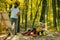 Happy Family vacation in the autumn Park. Father draws picture on nature. Happy family concept. Autumn camping with kids