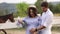 Happy family is waiting for baby. Pregnant woman and her husband in nature. Video