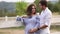 Happy family is waiting for baby. Pregnant woman and her husband in nature. Video