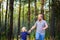 Happy family walks in the evening park, holding hands