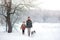 Happy family walks with a puppy huskies