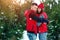 Happy family in warm clothes in the winter outdoors. Concept of holidays, holidays, winter, new year, day of grace. Family