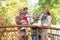 Happy family, wife, husband, daughters, walking with children, playing in autumn park, having fun in forest, relaxing