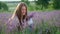 Happy farm girl with flowers basket, lavender field.
