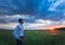 Happy farmer, businessman, standing in field with