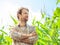 Happy farmer in front of his corn field