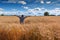 Happy farmer among ripening wheat, Europe