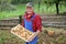 Happy farmer show his organic potato