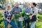 Happy farmers posing with a harvest of vegetables