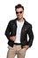 Happy fashion man in sunglasses and leather jacket