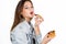 Happy fashion woman holding a piece of pizza. Girl eating pizza