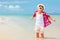 Happy fashionable kid boy enjoys life on summer beach