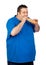 Happy fat man eating a large bread