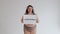 Happy fat woman in underwear with drearlocks holding body positive poster - I love myself. Diverse beauty, diversity