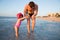 Happy father and adorable little girl at beach. Persian Gulf ,Dubai.