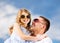 Happy father and child in sunglasses over blue sky