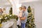 Happy father and cute daughter with regard festive decorations o