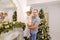 Happy father and cute daughter with regard festive decorations o