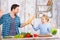 Happy father and daughter cooking together