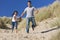 Happy Father and Daughter Running At Beach