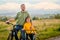 Happy father and daughter take bike ride in nature in autumn