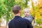 Happy father and his son outdoors. Child hugging daddy.