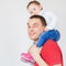 Happy father holding child at white background