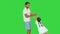 Happy father holding his daughter\'s hands and spinning around letting her fly on a Green Screen, Chroma Key.