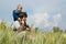 Happy father and little son on the field