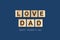 Happy father`s day background. Word, Love dad written on wooden blocks. Dark background Congratulatory background