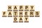 Happy Father`s Day inscription on wooden cubes on white background, isolated. Happy Father`s Day Concept. Greetings and gifts.