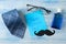 happy father`s day. text and men`s accessories, tie, perfume and glasses on a light blue wooden background. top view